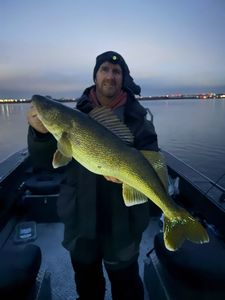 A solo fisherman reeling in their catch in Washington