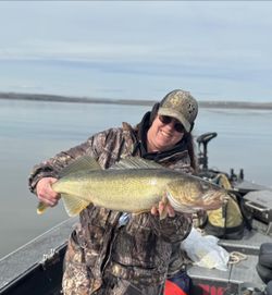 A lone fisherman reeling in a catch in Washington