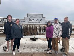 2 fishing enthusiasts reeling in their catch in TX