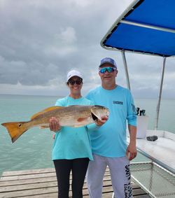 Two people fishing in TX