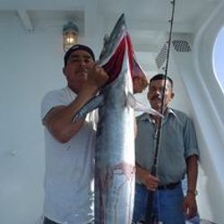 Two people fishing with a big fish in TX