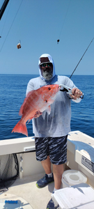 Angler with fishing rod enjoying scenic view in Panama City