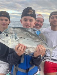 Photograph of an African Pompano, a large fish caught while fishing in FL.