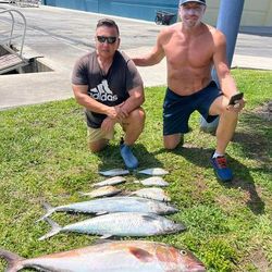 Two anglers fishing in FL with big fish