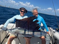 Angler with a massive Atlantic Sailfish caught off the coast of West Palm Beach