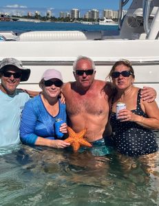 Four people enjoying a fishing cruise in West Palm Beach