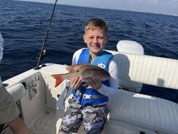 Reeling in a good catch on the open sea.