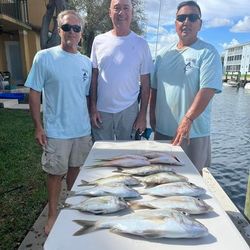 Three anglers fishing with boats in Florida waters
