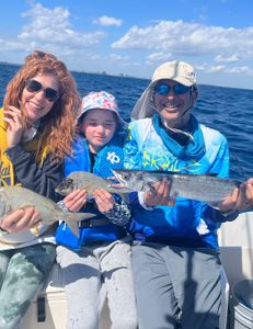 2 anglers fishing in West Palm Beach, Florida, on a cruiser boat