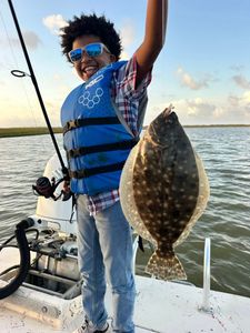A summer flounder caught by a person in Matagorda