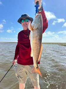Anglers fishing in Matagorda with a big 30-inch catch