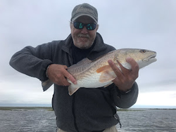 A fisherman with a 15-inch catch in Texas