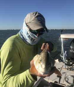 A person fishing in TX