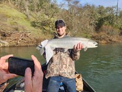 Angler with a 27-inch fish caught while fishing in Myrtle Creek