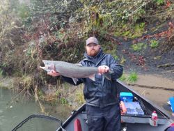 Angler holding a large rainbow trout in Oregon