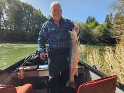 Angler with a rainbow trout caught in Oregon