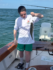 Enjoying a day by the water with a catch of the day.