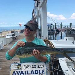 Angler holding a 28-inch fish in Marathon