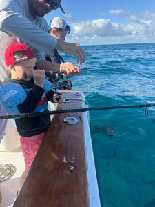 Reeling in a great catch on a beautiful day.