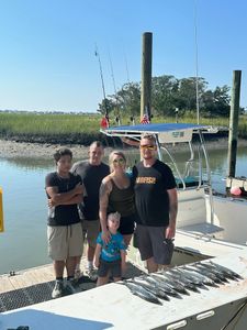Group of 5 people fishing at a location in SC