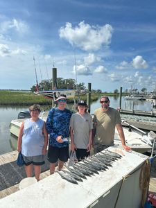 4 people enjoying a fishing trip in SC