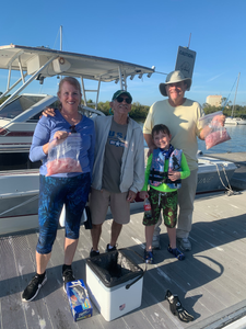 4 people enjoying fishing at location 33036