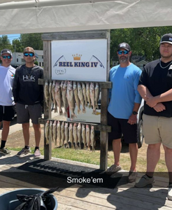 Four people enjoying a fishing trip in Michigan