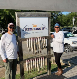 Two people fishing in MI