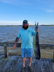 An angler fishing with a rod on Edisto Beach