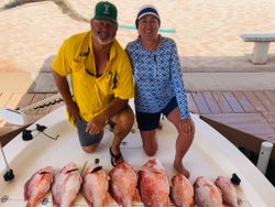 Two people fishing at Port Isabel