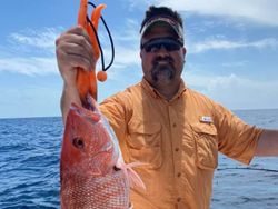 Angler with a 12-inch catch at Port Isabel