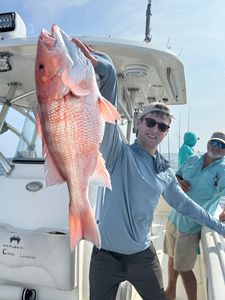 Red snapper caught while fishing in Port Isabel TX displayed on boat deck