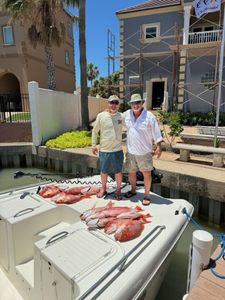 Fresh red snapper catch displayed on boat deck at Port Isabel TX marina