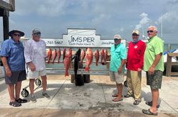 Red snapper fishing catch displayed on cleaning station at Jim's Pier in Port Isabel TX