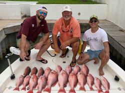 Fishermen with a catch of 6 unspecified fish in Port Isabel