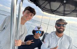 Three people fishing on the beach in Key Biscayne