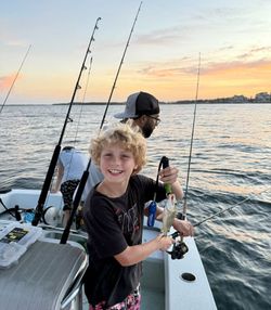 Two people fishing on the coast of FL