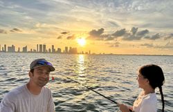 Two people enjoying a fishing trip in Key Biscayne