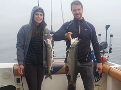 Two lake trout, 24 inches long, caught while fishing in MI
