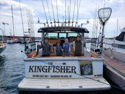 4 people enjoying a fishing trip in MI