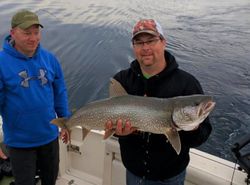 Angler with a large lake trout caught while fishing