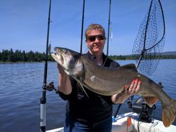 Angler holding a 29-inch fish in MI