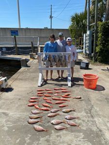 Three people fishing at Panama City Beach