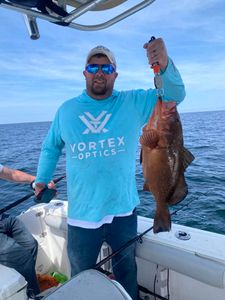 Angler fishing in Florida with barred sand bass