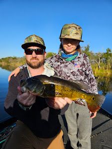 Two people fishing in the South Bay