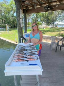A person fishing in the crystal river