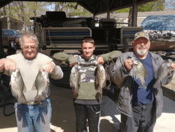 6 fishing enthusiasts enjoying their catch at Emory