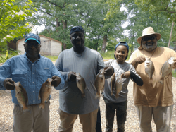 6 fishing enthusiasts enjoying their catch at Emory