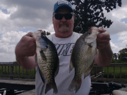 Two fishing rods with a person holding them in TX