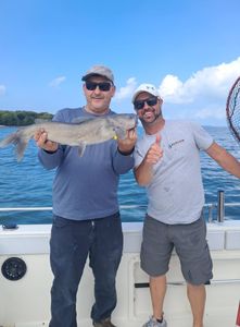 Two people fishing in Port Clinton